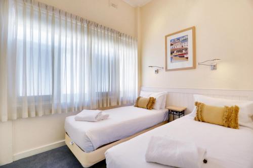 Ένα ή περισσότερα κρεβάτια σε δωμάτιο στο Bayview Family Apartments Glenelg