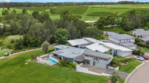 an aerial view of a house with a swimming pool at Olive Lakes in Pokolbin