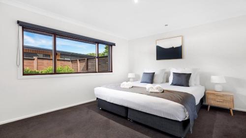 Ένα ή περισσότερα κρεβάτια σε δωμάτιο στο Peppertree Ponds