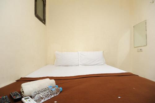 Giường trong phòng chung tại Ariane Rooms RedPartner