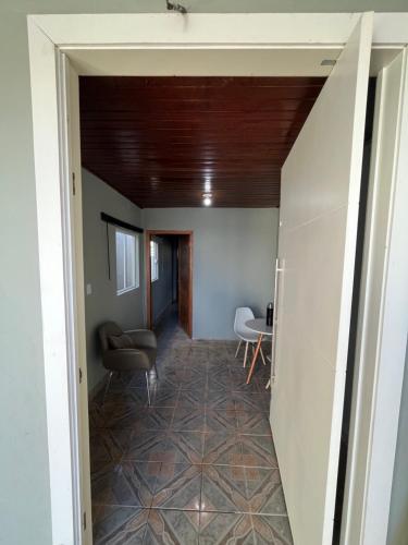 a hallway in a house with a ceiling at Suíte com sala de estar in Porto Velho