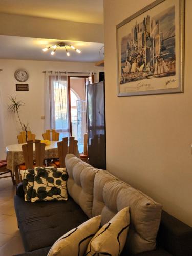 a living room with a couch and a table at Villa Kety in Prigradica