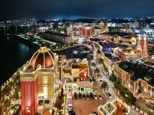 a view of a city at night at Vessel Hotel Campana Okinawa in Chatan