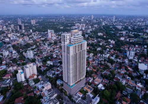 an aerial view of a tall building in a city at The Grand ward place super luxury 2 bedroom apartment Colombo 7 in Colombo
