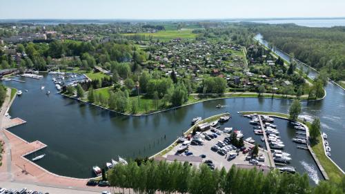 an aerial view of a marina with boats in the water at Bajkowe Domki Marzeń Taborecik in Węgorzewo