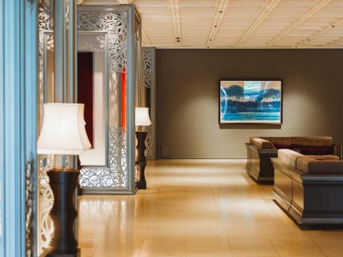 a living room with a couch and a table at Tokyo Prince Hotel in Tokyo