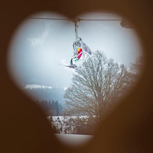 a person on skis on a ski lift at Ski in/Ski out Chalets Tauernlodge by Schladming-Appartements in Schladming