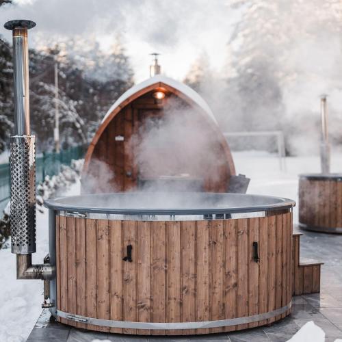 a hot tub with a grill in the snow at Villas Jagoda & Malina in Borovets