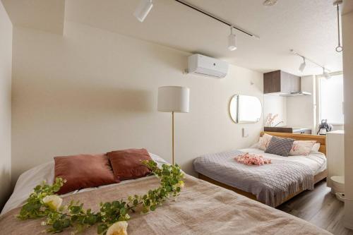 リリハウス笹塚 tesisinde bir odada yatak veya yataklar