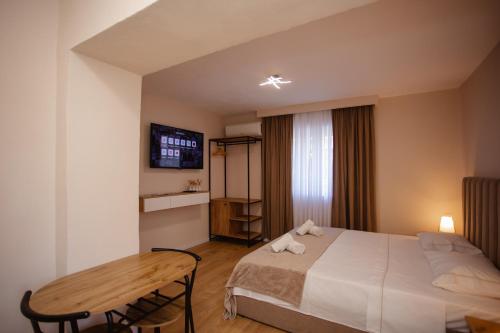 Postel nebo postele na pokoji v ubytování City Center Studio Apartments