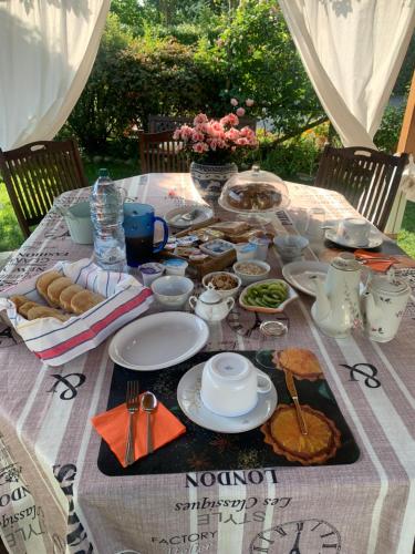 a table with plates of food on it at La Casa di Biba in Massa Lombarda