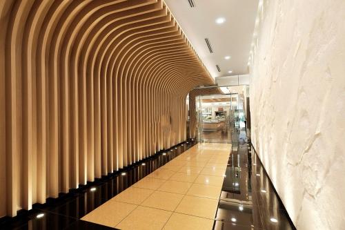 a hallway of a building with a wooden wall at Nilai Springs Resort Hotel in Nilai