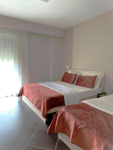 Ένα ή περισσότερα κρεβάτια σε δωμάτιο στο Hotel Nais Beach