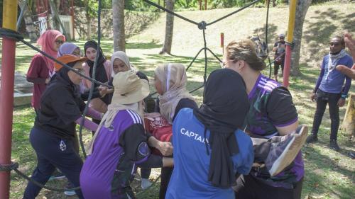 a group of people on a swing at Nilai Springs Resort Hotel in Nilai