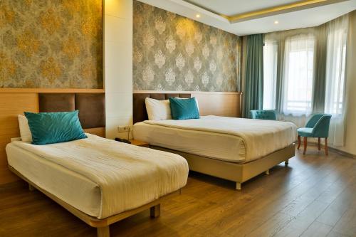 Ένα ή περισσότερα κρεβάτια σε δωμάτιο στο Start Hotel