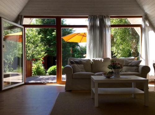 a living room with a couch and a table at Haus Wittensee in Bünsdorf