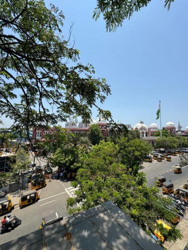 a parking lot with cars parked in a parking lot at Sangeetha Business Hotel in Chennai