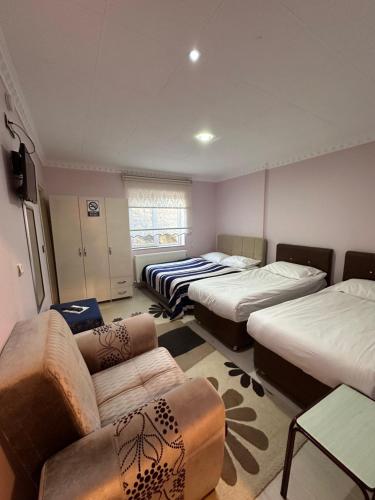 Postel nebo postele na pokoji v ubytování Dirilis Banarya Apart hotel