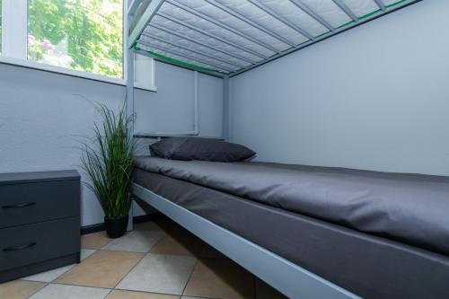 a couch in a room with a window at Seven Apart Hotel in Vyshneve