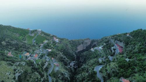 an aerial view of a mountain with the ocean at Agriturismo Orrido di Pino in Agerola