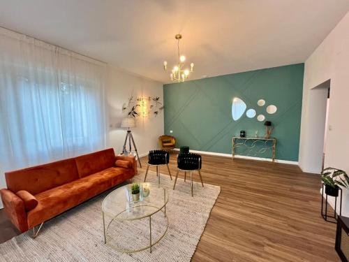 a living room with a couch and a table at Civico Uno Appartamento in Torgiano