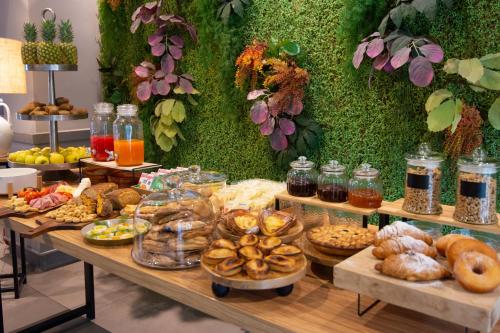 a table filled with lots of different types of food at Hotel Aloisi in Lecce
