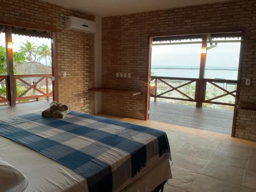 Postel nebo postele na pokoji v ubytování BEACH HOUSE Residência - at the Beach