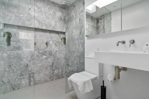 a bathroom with a sink and a shower at Tranquil Haven in Balmain in Sydney