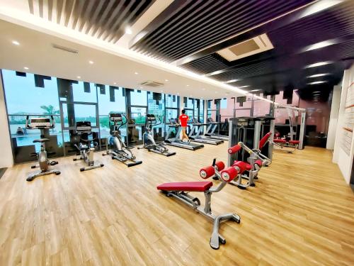a gym with a bunch of treadmills and machines at Meritus Residensi Penang in Perai