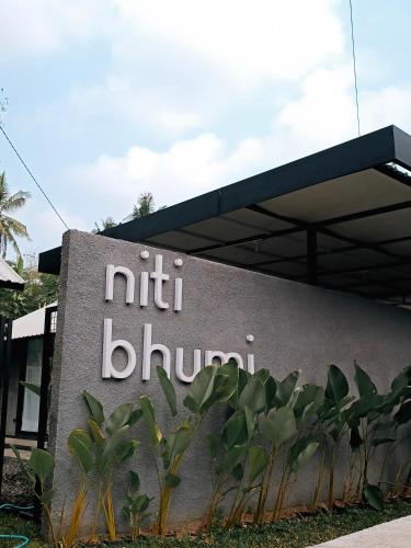 a sign for the nittil blumbmann building at Niti Bhumi Villa in Borobudur
