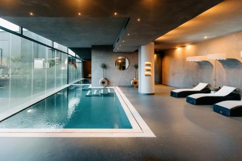 a house with a swimming pool in a room at Rubens Hotels & SPA in Vila Nova de Gaia