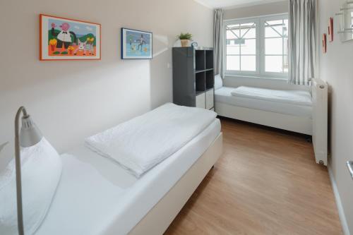 Katil atau katil-katil dalam bilik di Haus Sanderling Juister Gezeiten