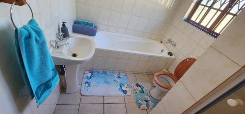 a small bathroom with a sink and a toilet at 20 Pendleberry Holiday Resort in Bela-Bela