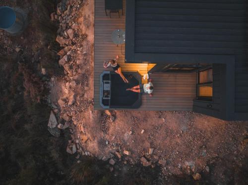an overhead view of two people standing on a house at Springsteen Cabins in Rawsonville
