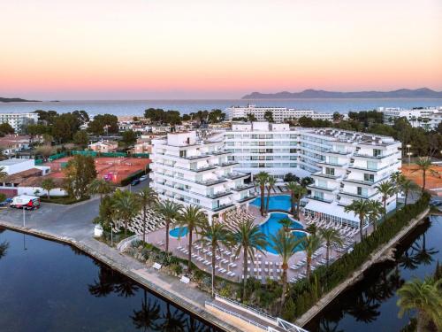 an aerial view of a resort with a pool at VIVA Eden Lago in Port d'Alcudia