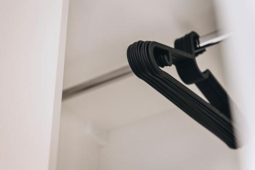 a black hose hanging from a door handle at Dock 1 Boutique Hotel in Cospicua
