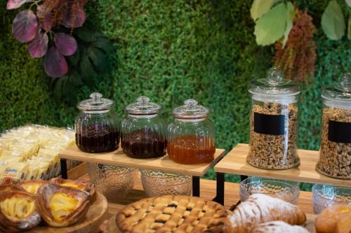 a display of jars of food on shelves with cookies at Hotel Aloisi in Lecce