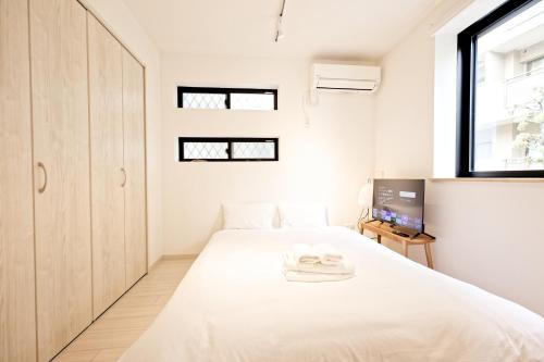 Katil atau katil-katil dalam bilik di Calm Riverside Inn Close to Ikebukuro