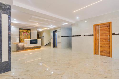 a large room with a lobby with a door at Super Townhouse Gachibowli Near Sky View in Kondapur