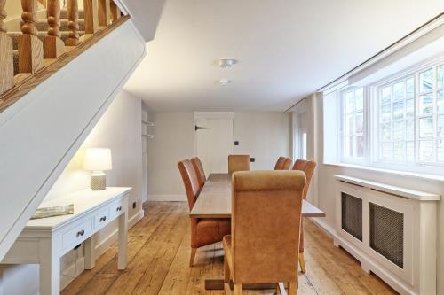 a dining room with a table and chairs at Ranfield's Brasserie Hotel Rooms in Coggeshall