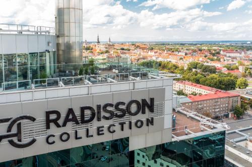 a view from the top of a building with the rysson collection sign at Radisson Collection Hotel, Tallinn in Tallinn