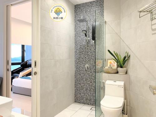 a bathroom with a toilet and a shower at Sea Park LeSu 8 The Shore KK I 1 plus 1 Room 2-3 Pax 홈스테이 A1710 in Kota Kinabalu