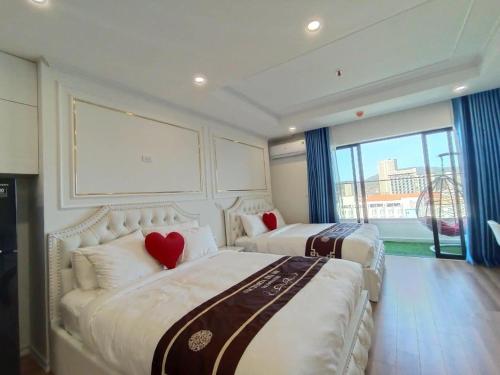 Postel nebo postele na pokoji v ubytování TMS Luxury Residence Quy Nhơn