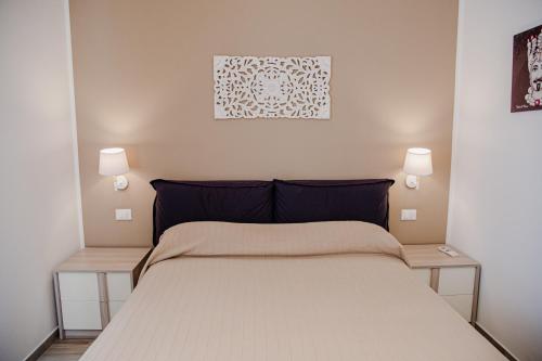 Postel nebo postele na pokoji v ubytování Casa Corallo San Vito