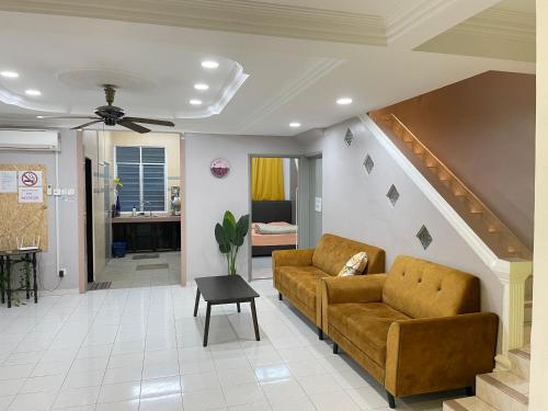 a living room with a couch and a table at 8min Port Dickson beach 17pax Pet Friendly in Port Dickson