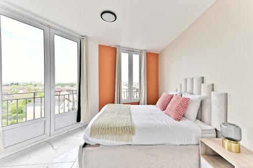 a bedroom with a bed and a large window at Serenity spot at Gagny - Near Paris in Gagny