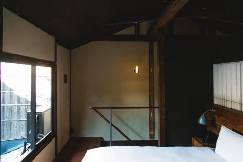Una cama o camas en una habitación de Sowaka