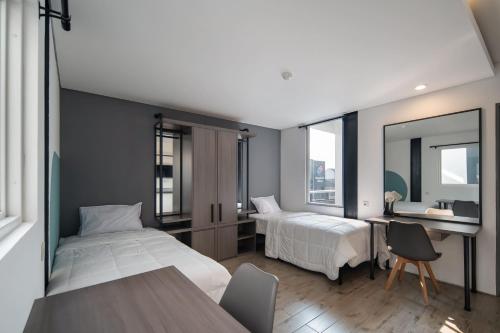 Ένα ή περισσότερα κρεβάτια σε δωμάτιο στο Cove Art Living