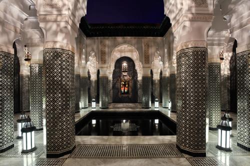 a room with a pool of water in a building at Selman Marrakech in Marrakech