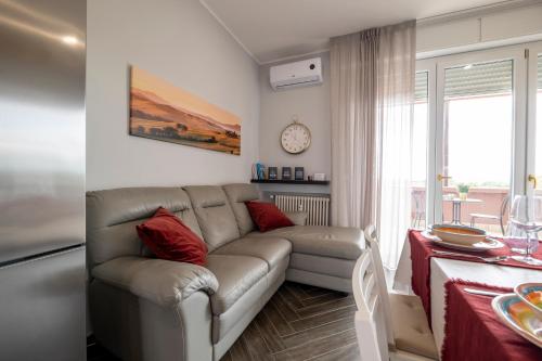 a living room with a couch and a table at Forlì Park View in Forlì